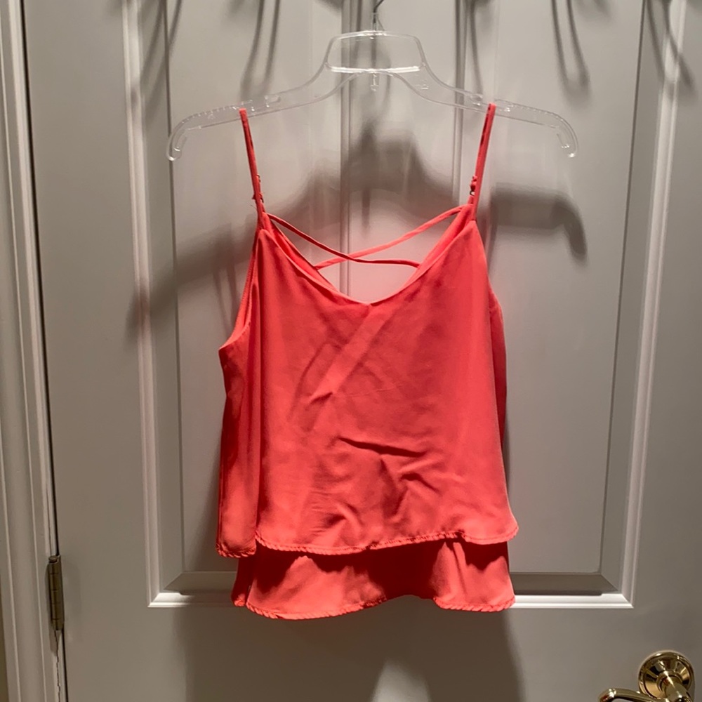 pink small ruffle tank with cross in back
